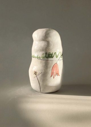 Decorative ceramic vase with tulips