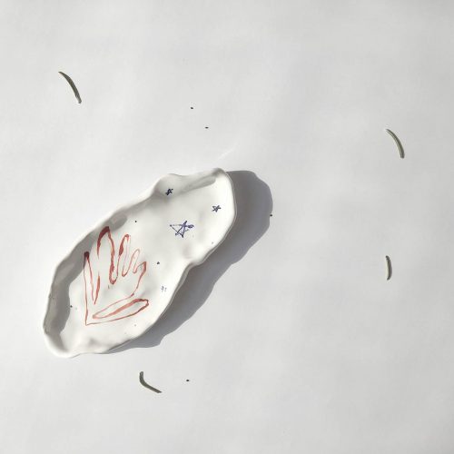 Oval plate with red flower