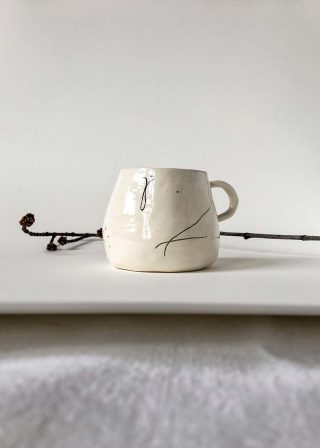 Ceramic cup handmade with abstract drawing